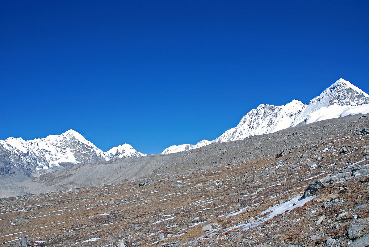 11 First View Of Shishapangma From Plateau With Views Of Pemthang Ri, Goldum, Risum, Yebokangjiat, Shishapangma, Pungpa Ri and Nyanang Ri As Trek Nears Shishapangma Southwest Advanced Base Camp I pass base camp and catch my first real view of Shishapangma Southwest Face from a boulder-studded plateau. From left to right, the mountain view includes Pemthang Ri (6842m), Goldum (6630m), Risum (7050m), Yebokangjiat (7068m), Shishapangma, Pungpa Ri (7445m) and Nyanang Ri (7071m).